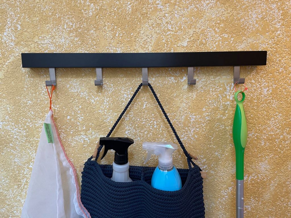 This zip tie hack cleans up your broom storage